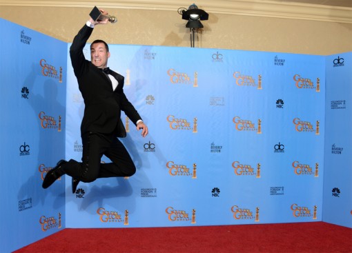 Mark Andrews leaps with his award at the 70th Annual Golden Globe Awards.