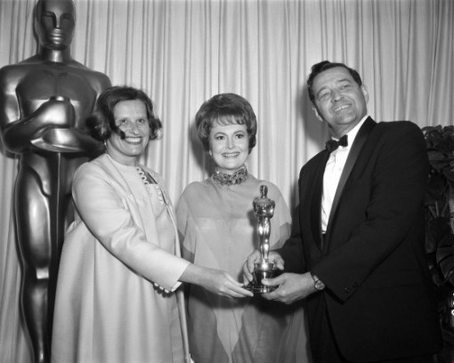 John and Faith Hubley receiving an Oscar from Olivia de Havilland